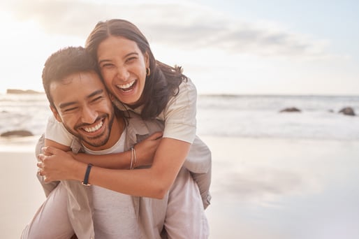 Married couple enjoying each other at beach