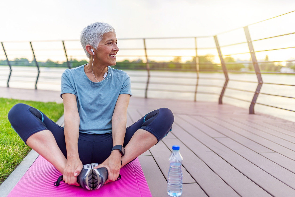 Senior woman on yoga mat