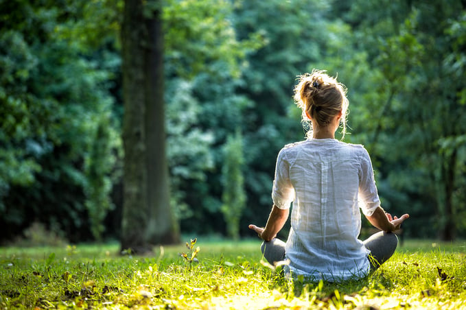 Woman-meditating-outside-in-nature