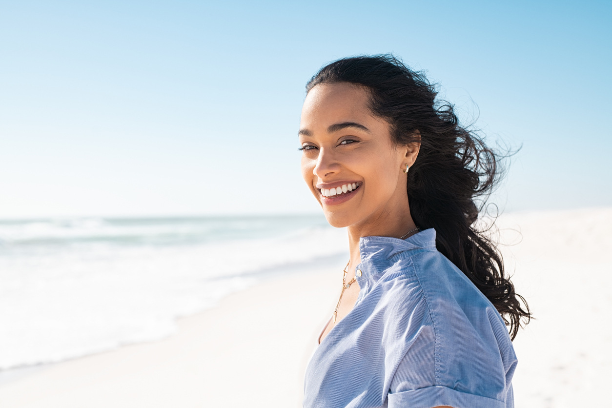 Young hispanic woman at the beach